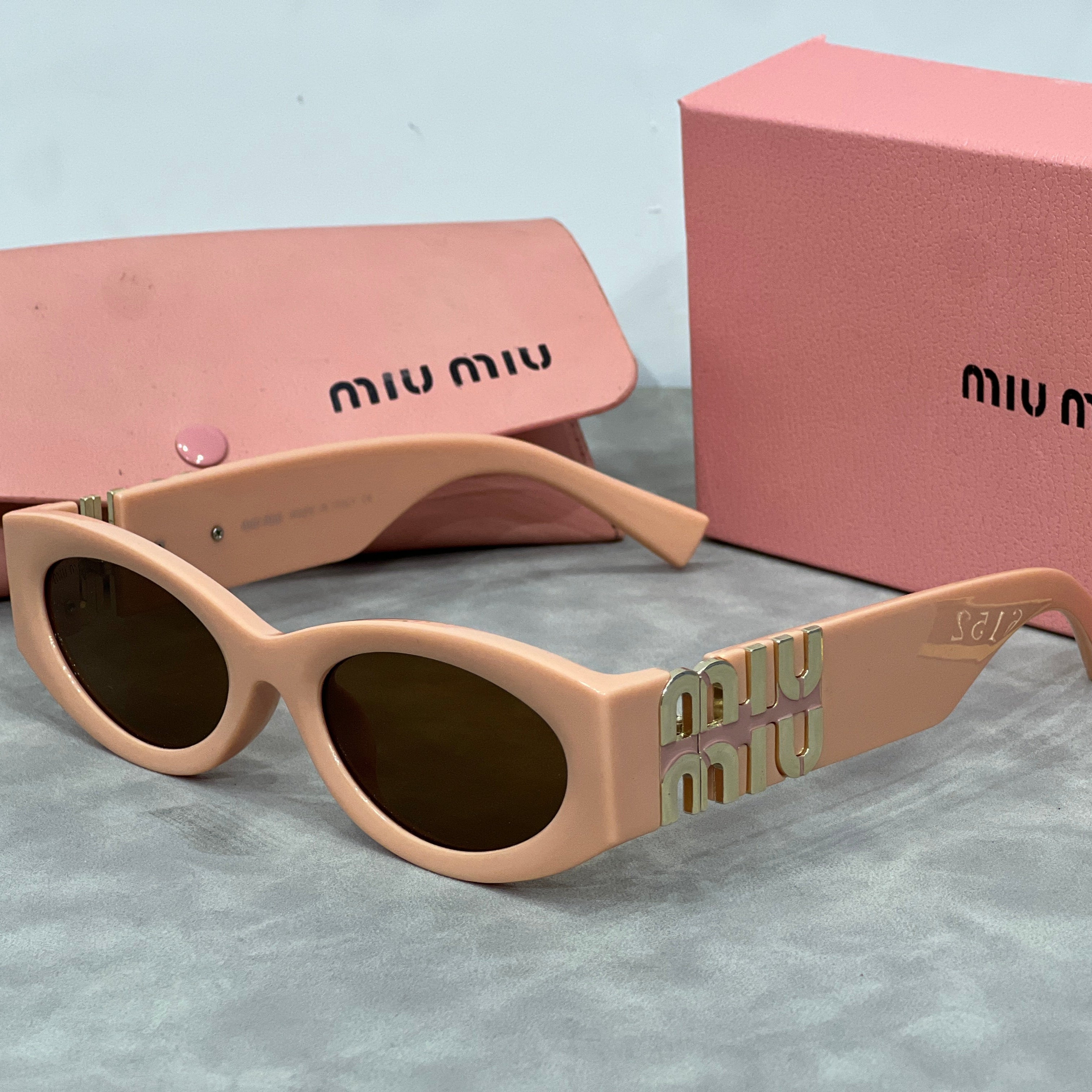 Miu Miu Cat Eye Sunglasses with Logo